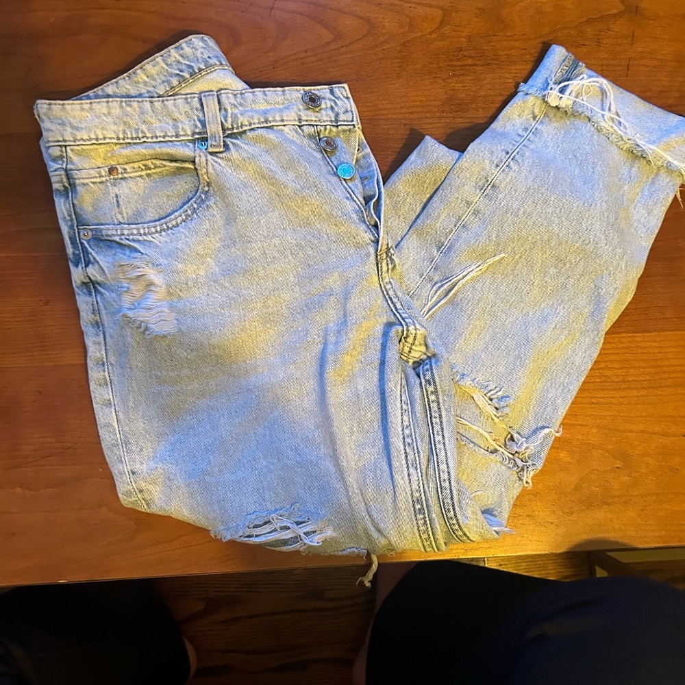 Light wash distressed denim baggy button up mom jeans